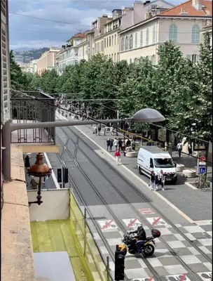 a person riding a motorcycle on a city street at Gustave 2 in Nice