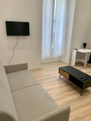 a living room with a couch and a coffee table at Gustave 2 in Nice