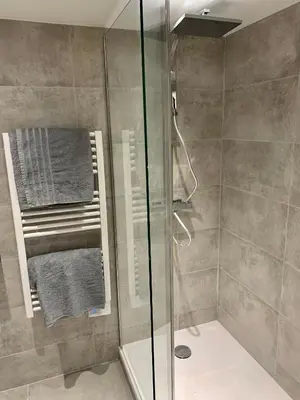 a shower with a glass door in a bathroom at Gustave 2 in Nice