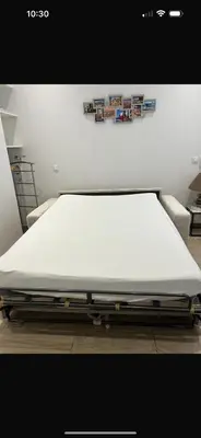 a bed in a room with a white mattress at Appart hyper centre Nice in Nice