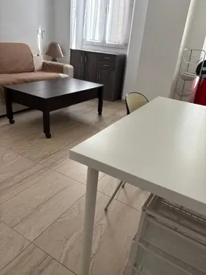 a living room with a table and a couch at Appart hyper centre Nice in Nice