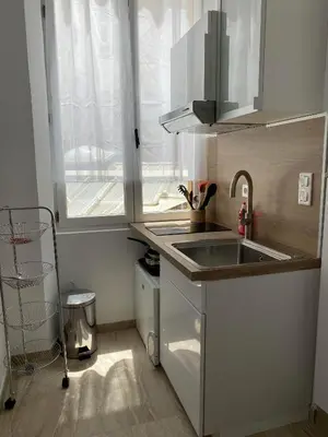 a small kitchen with a sink and a window at Appart hyper centre Nice in Nice