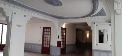 a room with a white ceiling and red doors at Large beautiful studio near the NEGRESCO HOTEL in Nice