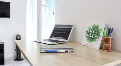 a laptop computer sitting on top of a desk at NICE - Studio cosy hypercentre à 500m de la plage in Nice