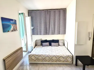 a small bedroom with a bed in a room at NICE - Studio cosy hypercentre à 500m de la plage in Nice
