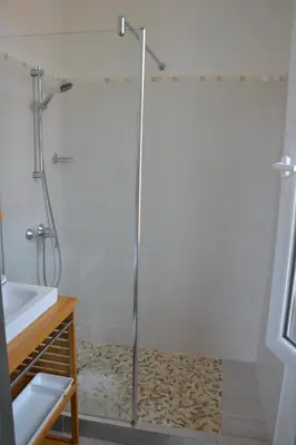 a shower with a glass door in a bathroom at Les Lauriers in Villefranche-sur-Mer