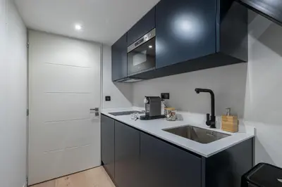 a kitchen with a sink and a microwave at Studio Duplex - Vieux Nice - 100m de la mer in Nice