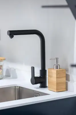 a kitchen sink with a faucet and a wooden block at Studio Duplex - Vieux Nice - 100m de la mer in Nice