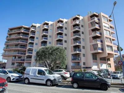 a building with a sign for a shopping center at Studio Le Baccara by Interhome in Cagnes-sur-Mer