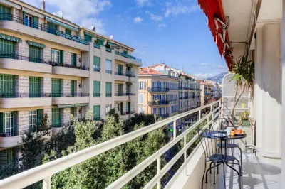 a living room with a couch and a table at #29 Suite Gambetta AC Sea view 2 bedrooms 1min Walk to Promenade & Sea in Nice