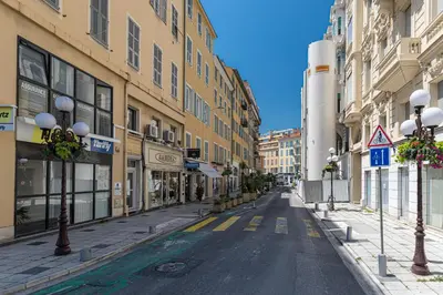 an empty street in a city with buildings at Lovely Apartment City Center Heart - AC in Nice