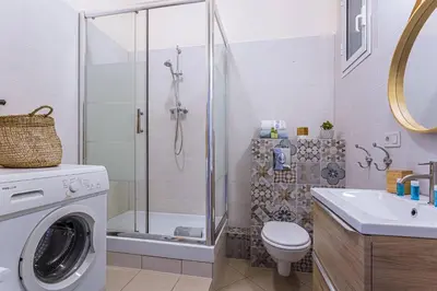 a bathroom with a shower and a washing machine at MY CASA - DIJON - Near Train Station - Malaussena in Nice