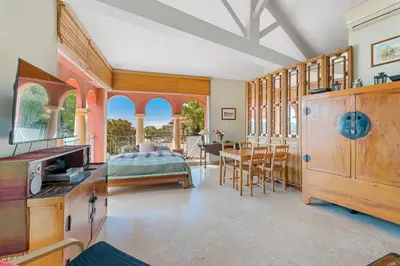 a kitchen and dining room with a table and chairs at Penthouse La Bellevue in Villefranche-sur-Mer
