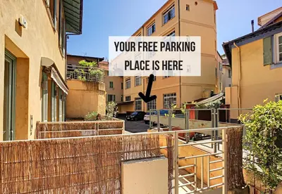a sign that reads your free parking place is here at Nestor&Jeeves - HOLIDAY VIBES - Very close sea - Free parking in Nice