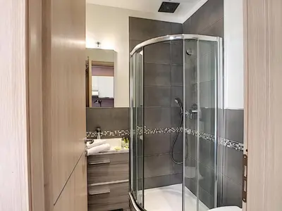 a bathroom with a shower with a toilet and a sink at Nestor&Jeeves - HOLIDAY VIBES - Very close sea - Free parking in Nice