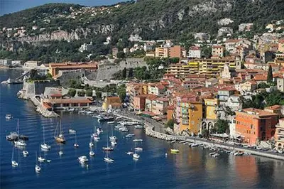 a group of boats in a harbor in a city at Charmant studio climatisé centre Villefranche sur mer in Villefranche-sur-Mer