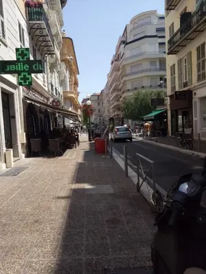 a city street with buildings and a car on the street at Logement de Catherine in Nice