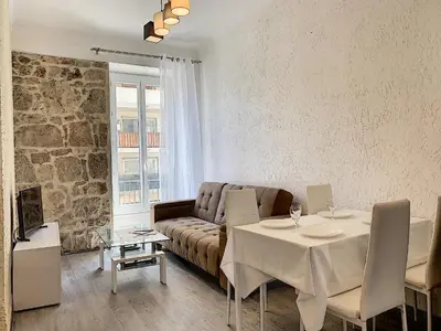 a living room with a couch and a table at 2-bedrooms аpartment Nice Port with parking in Nice