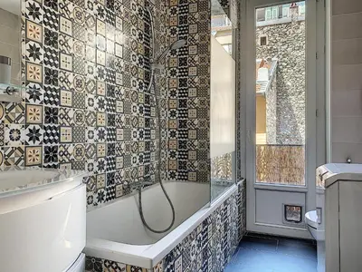 a bathroom with a shower and a bath tub at 2-bedrooms аpartment Nice Port with parking in Nice