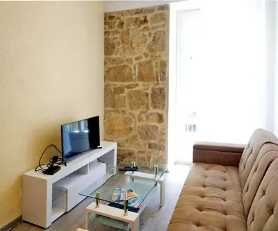 a living room with a couch and a tv at 2-bedrooms аpartment Nice Port with parking in Nice