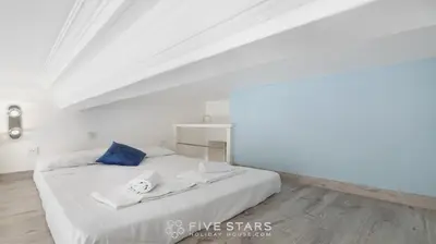 a white bedroom with a bed with towels on it at Studio Imperator Five stars holiday house in Nice