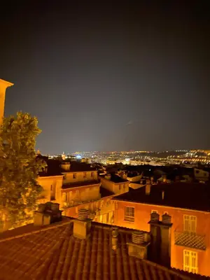 a view of a city skyline at night at CHARMANT HOME-Azur Charmant in Nice