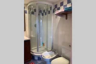 a bathroom with a shower and a toilet and a sink at CHARMANT HOME-Azur Charmant in Nice