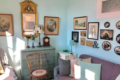 a living room with a purple couch and a dresser at CHARMANT HOME - Mariesol in Nice