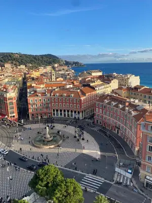 an aerial view of a city with buildings and a fountain at T2 RDJ sur la Côte d'Azur tout confort in Cagnes-sur-Mer