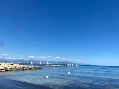 a large body of water with sailboats in the water at T2 RDJ sur la Côte d'Azur tout confort in Cagnes-sur-Mer
