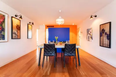 a dining room with a table and chairs at LE FRANCIA II AP4197 By RIVIERA HOLIDAY HOMES in Nice