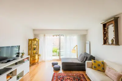 a living room with a couch and a tv at LE FRANCIA II AP4197 By RIVIERA HOLIDAY HOMES in Nice
