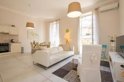 a living room with a white couch and a table at 