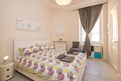 a bedroom with a large bed and a window at 