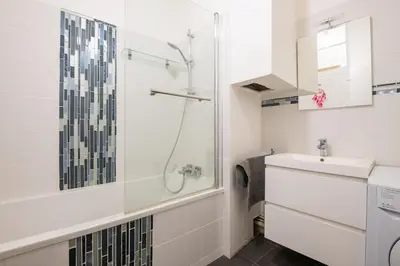a bathroom with a shower and a sink at 
