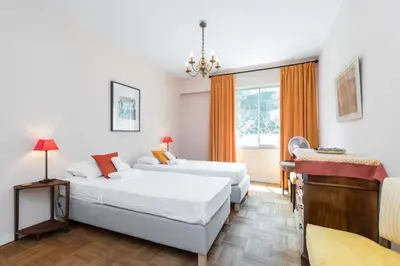 a bedroom with two beds and a desk at Sea View Park Swimming Pool & Tennis 2 Bdrs in Villefranche-sur-Mer