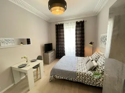 a bedroom with a bed and a table and a desk at Nice Renting - BUFFA - Cosy Studio fully equipped - Beach & Negresco in Nice