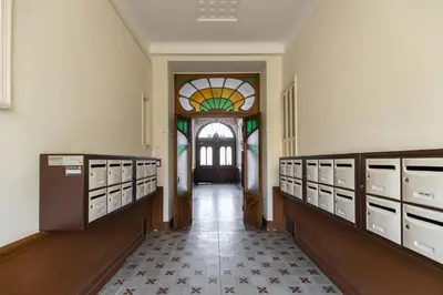 a hallway with lockers and a stained glass window at Refined & Cozy 1 Bedroom Downtown in Nice