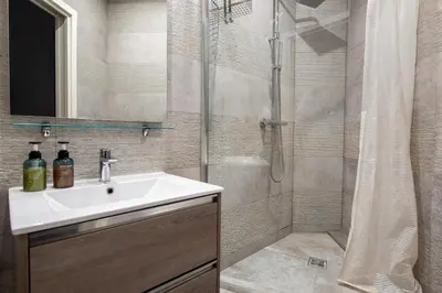 a bathroom with a sink and a shower at LAMARTINE- Heart of Center- Modern and Design flat in Nice