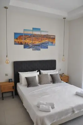 a bedroom with a large bed with two paintings on the wall at Silver Beach Central 4pers Séjour 30jours Location éligible au Bail Mobilité Mobility Lease in Nice