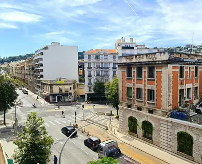 a view of a city street with cars and buildings at Evelia Hotels in Nice
