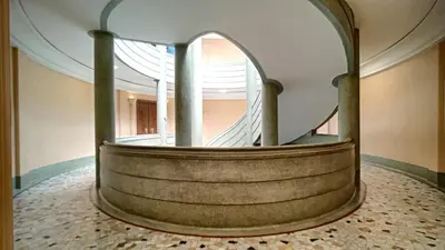 a spiral staircase in a building with a round stair case at Nestor&Jeeves - GLORIA BEACH - Very close sea - Prestigious building in Nice