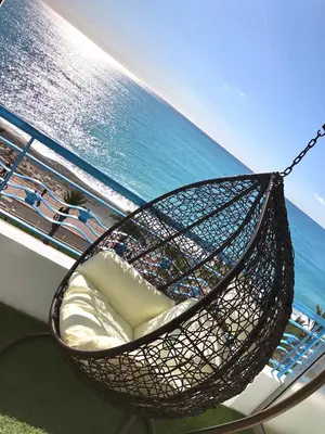 a hammock on a boat next to the ocean at Sea view - Promenade des Anglais in Nice