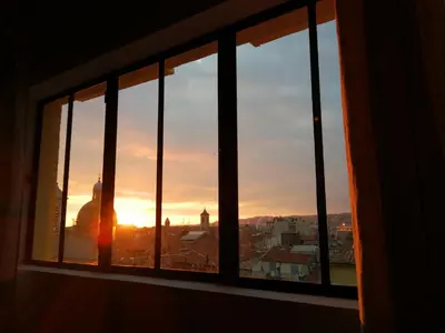 a view of the sunset from a window at COCOON LOFT - MAGNIFIQUE LOFT SOUS TOIT, REFAIT A NEUF, VUES SPLENDIDES, CLIM, WIFi in Nice