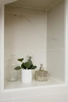 a shelf with a plant and a bottle on it at COCOON LOFT - MAGNIFIQUE LOFT SOUS TOIT, REFAIT A NEUF, VUES SPLENDIDES, CLIM, WIFi in Nice