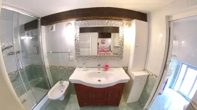 a bathroom with a sink and a shower and a mirror at Cosy Duplex au Port du Vieux Nice in Nice