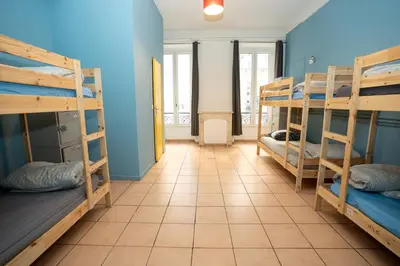 a room with bunk beds in a hostel at Le Pastoral in Nice