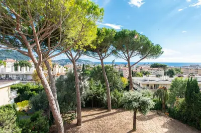 a view of a city with trees and bushes at Elegance in Nice