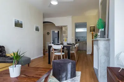 a living room and kitchen with a table and chairs at MY CASA - GIOFFREDO 14 - Spacious apartment with balcony in Nice