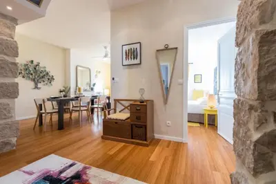 a living room with a table and a dining room at MY CASA - GIOFFREDO 14 - Spacious apartment with balcony in Nice